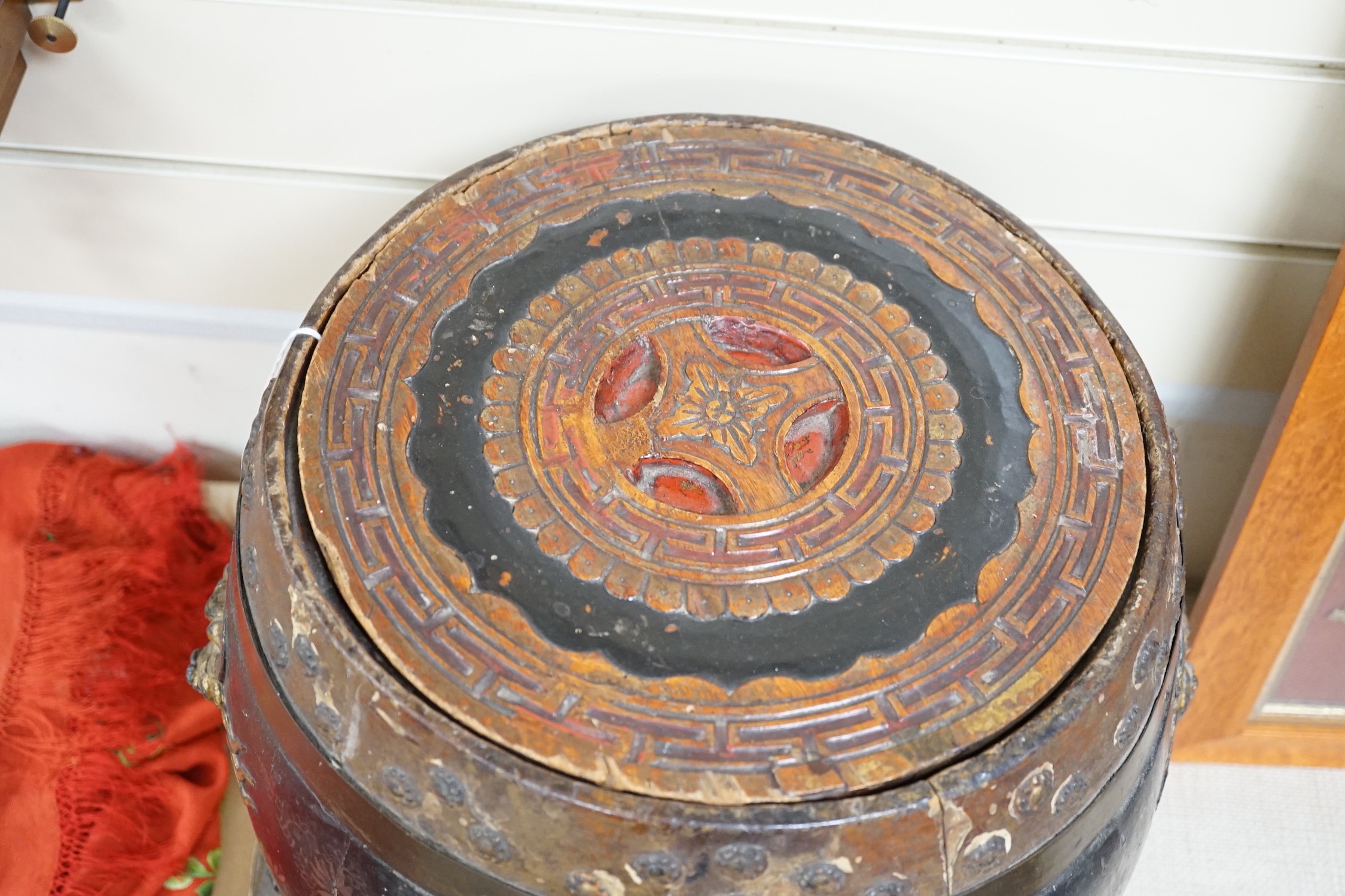A Chinese lacquer decorated wood barrel form seat/storage container, 40cms high
